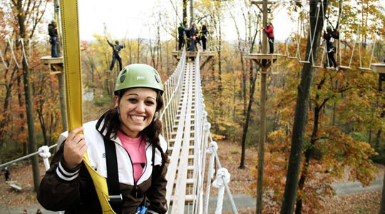 photo of students participating in high ropes activity