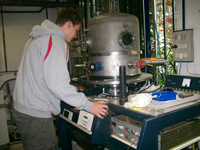 Undergraduate student Samuel Young (Iowa State) prepares thin film glass samples in Madrid, Spain for his international REU